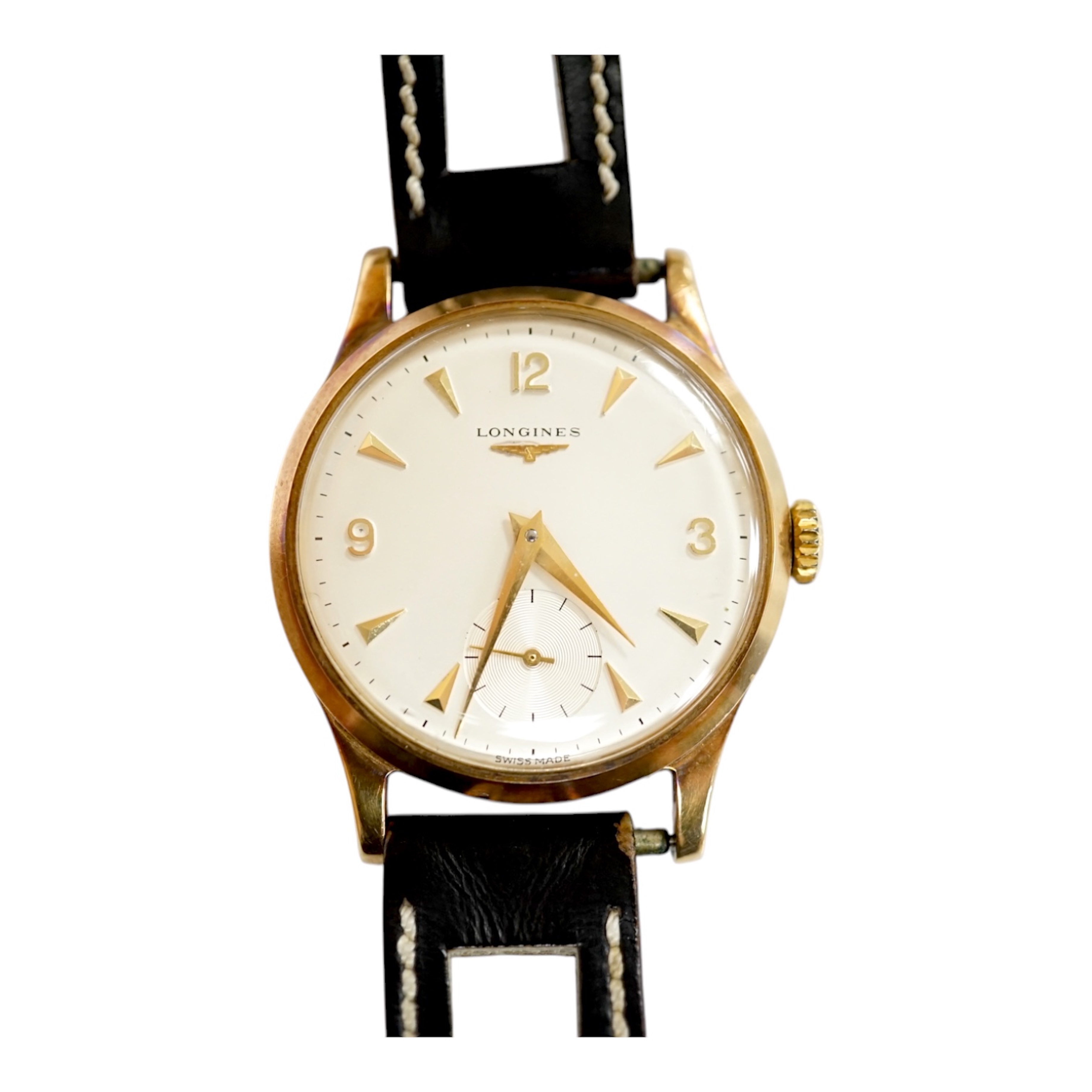 A gentleman's 9ct gold Longines manual wind wrist watch, with subsidiary seconds, case diameter 34mm, on a later associated leather strap, with Longines box. Condition - fair